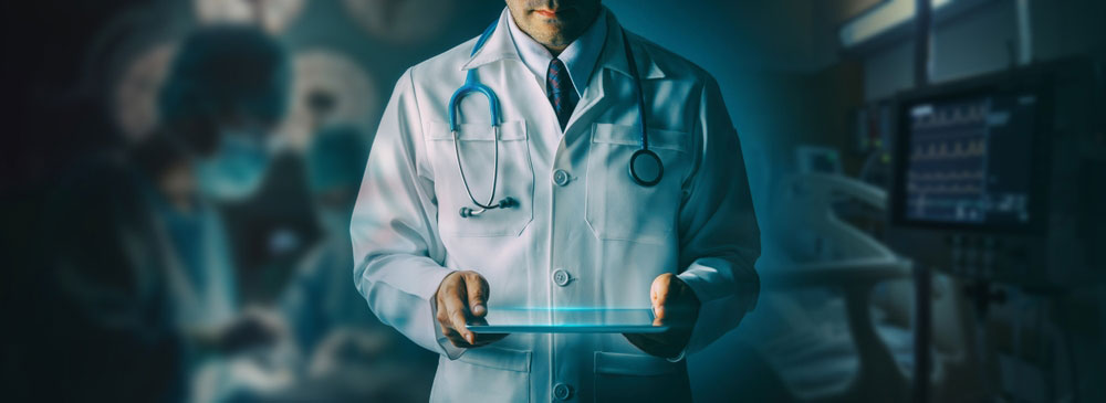 Doctor standing working on a digital tablet