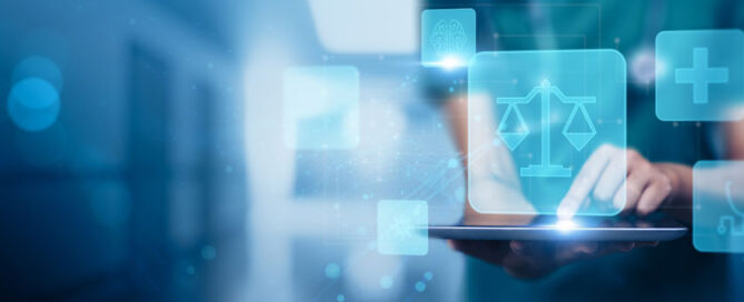 Medical professional holding tablet that has medical compliance icons floating above it